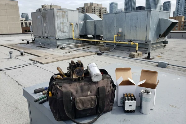 Failed contactor and capacitor removed from a rooftop unit