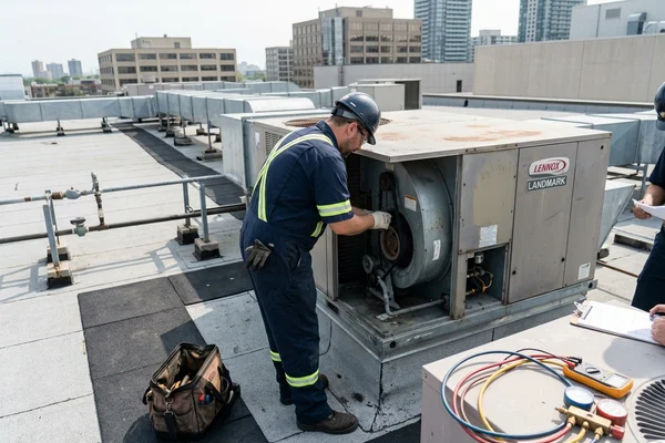 Replacing a blower belt on a rooftop unit
